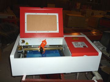 China Desktop Laser Engraver Co2 Laser Engraving And Cutting Machine For Carving Chapter And Artistic Works supplier